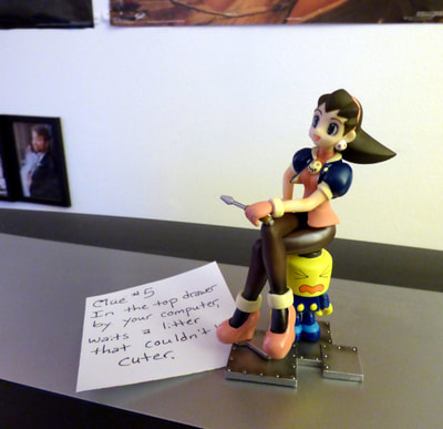 Tron Bonne figurine and clue #5, on top of TV